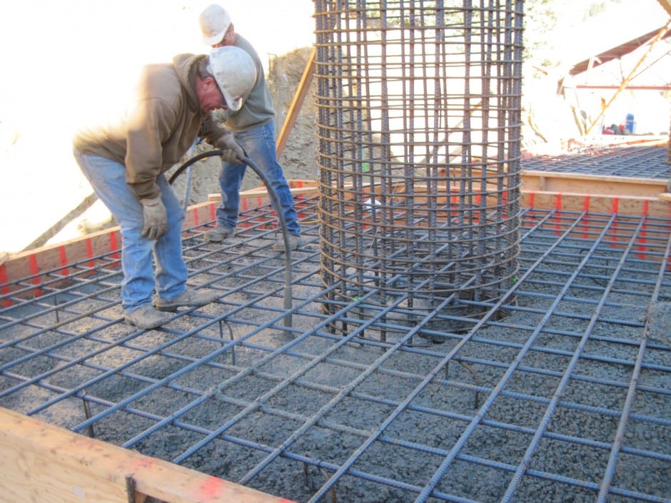 Pouring of foundations for wind fencing dust control for mining